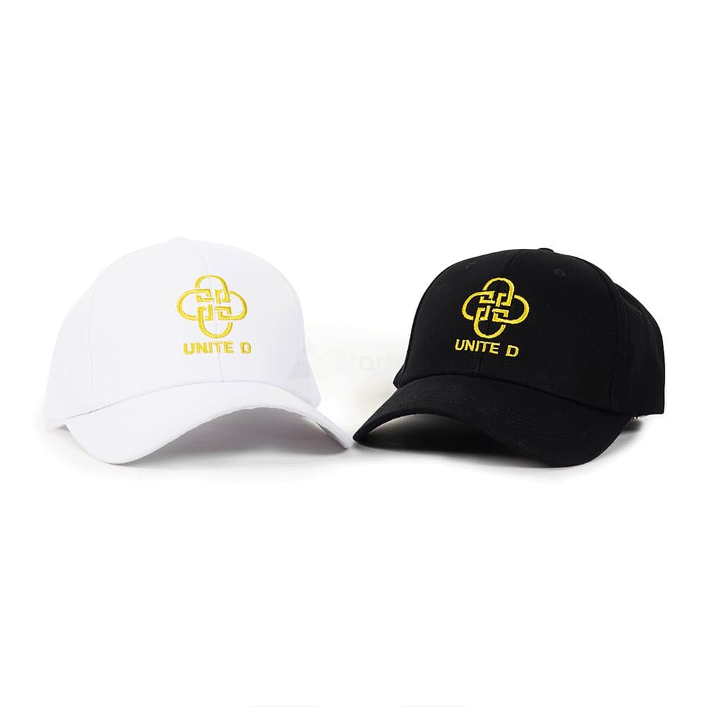White and black twill caps with a gold embroidered logo