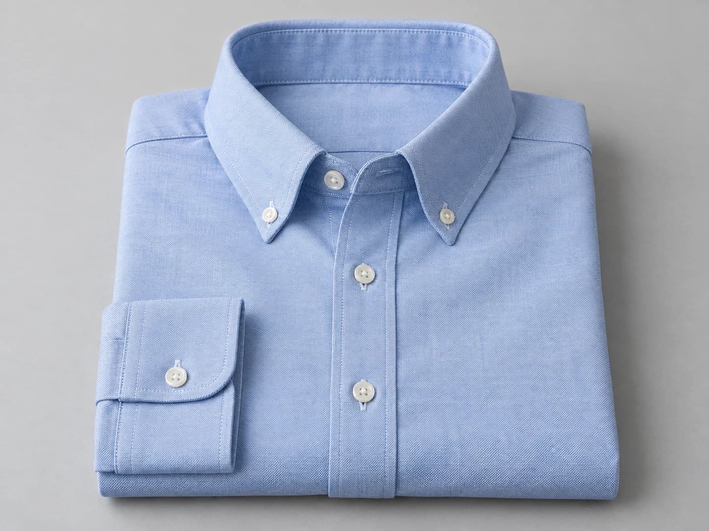 Illustration of a light-blue oxford-weave dress shirt for uniforms